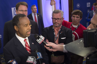 Republican Presidential candidate retired neurosurgeon Ben Carson speaks to the press after  the Republican Presidential debate sponsored by Fox News at the Iowa Events Center in Des Moines, Iowa on January 28, 2016. / AFP / AFP PHOTO / Jim WATSON